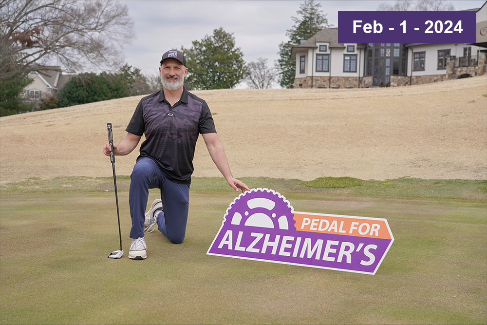 Knoxville health expert Eddie Reymond announces the Eddie’s 550 Tee Off for Alzheimer’s charity golf event that will welcome celebrities and the public to join in the fight against Alzheimer’s. Eddie practicing on the gold course with a Pedal for Alzheimer's sign for his charity golf event.