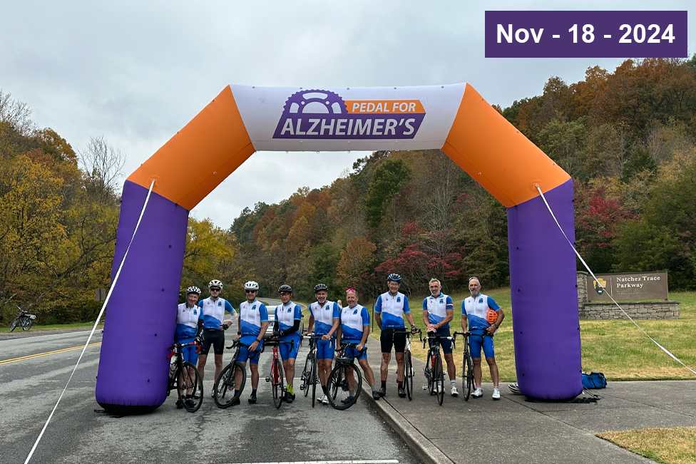 Pedal for Alzheimer's cyclists gather for a picture at the entrance to Natchez Chase Parkway