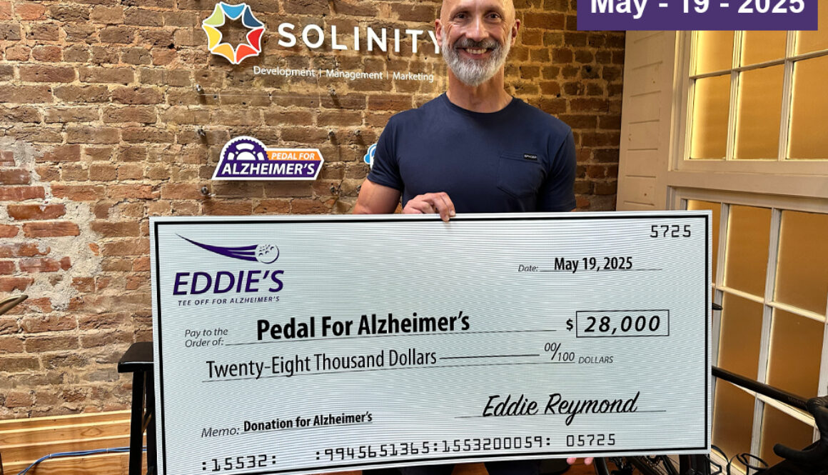 Eddie Reymond presents check for $28,000 to Pedal for Alzheimers