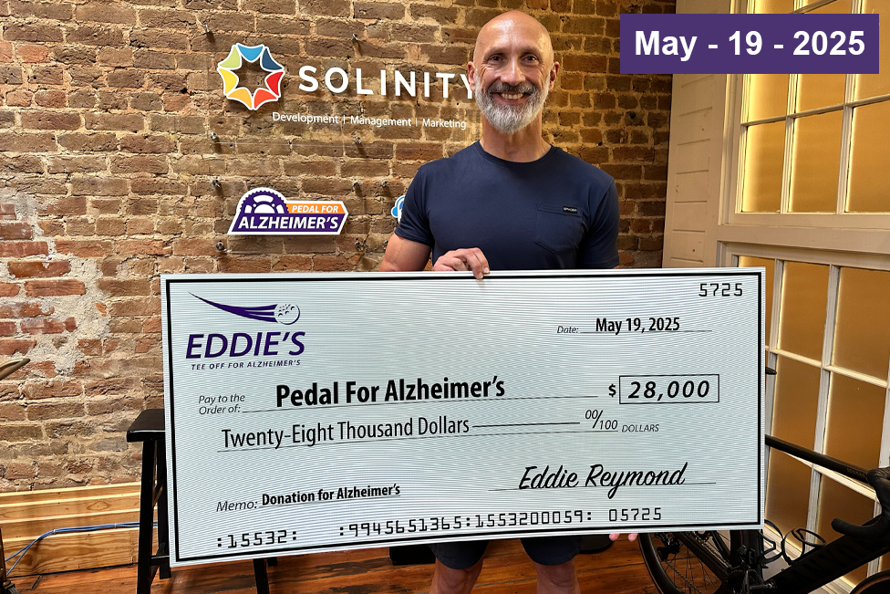 Eddie Reymond presents check for $28,000 to Pedal for Alzheimers
