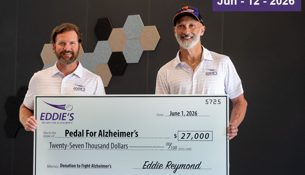 Eddie from Eddie's Health Shoppe and Josh Crisp Founder of Pedal for Alzheimer's pictured for Eddie’s Tee Off for Alzheimer’s Issues $27,000 to Pedal for Alzheimer’s check presentation