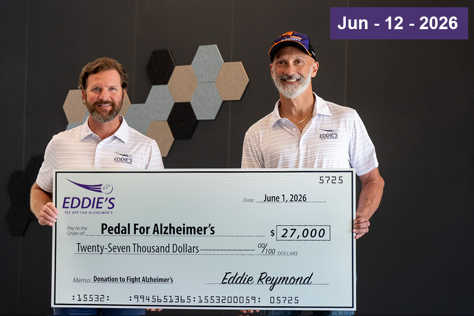 Eddie from Eddie's Health Shoppe and Josh Crisp Founder of Pedal for Alzheimer's pictured for Eddie’s Tee Off for Alzheimer’s Issues $27,000 to Pedal for Alzheimer’s check presentation